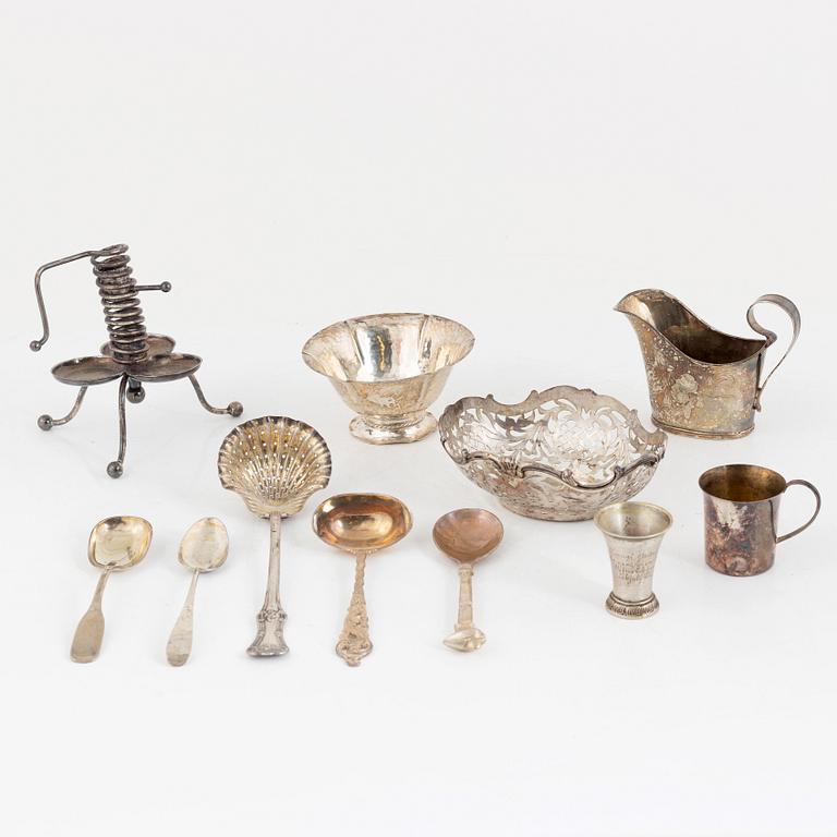 Bowls, cups, cutlery, cream jug, and candlestick, 11 pieces, silver. Including K Anderson, Stockholm 1923.