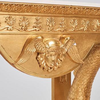 A pair of Swedish Empire carved and giltwood console tables, first half of the 19th century.