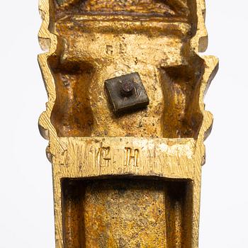 A set of four gilt bronze Louis XVI-style curtain holders, late 19th century.
