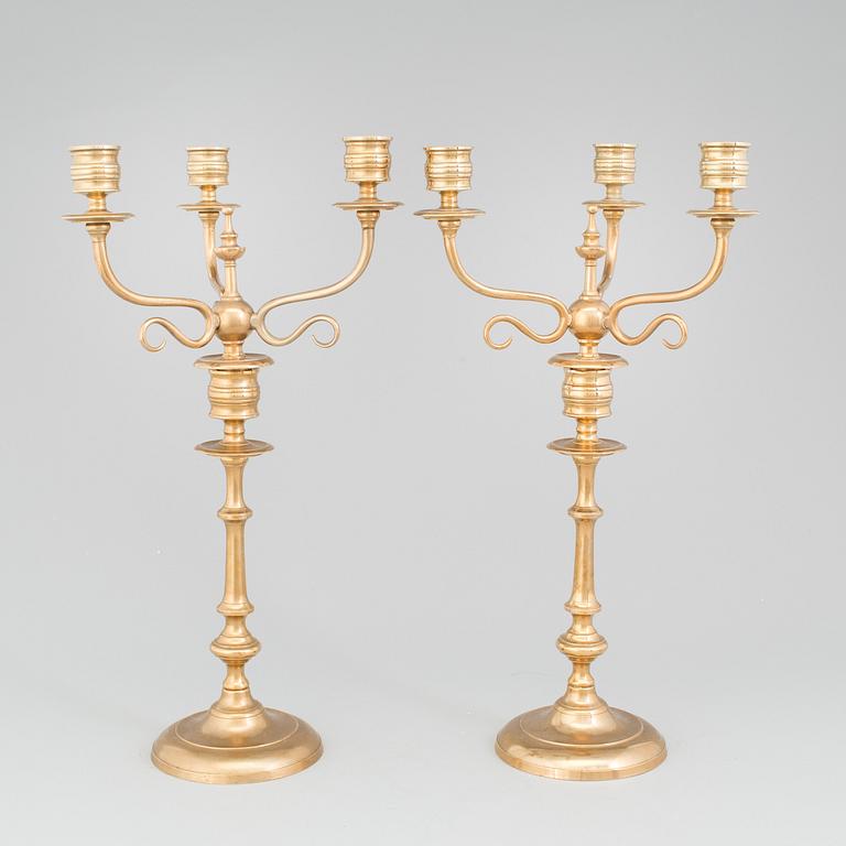 A pair of Candelabra, in brass Westerås Metallfabriks AB, late 19th century.