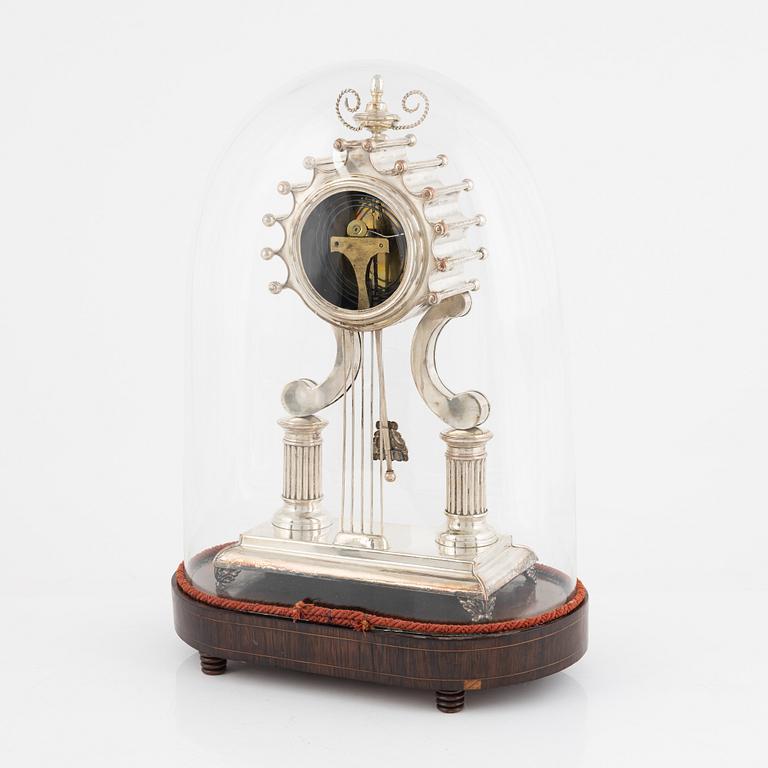 A silver-plate table clock, Empire, mid 19th century.