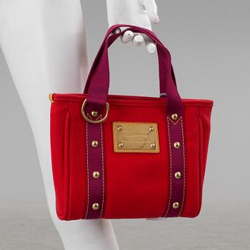 Handbag by Louis Vuitton.