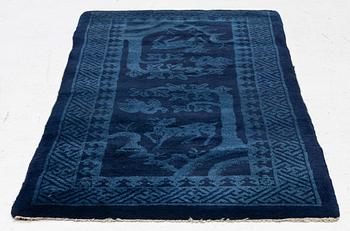 An antique Baotou rug, North China, c 157 x 75 cm.