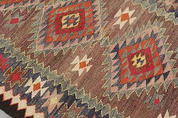 A Kelim rug, c. 253 x 120 cm.