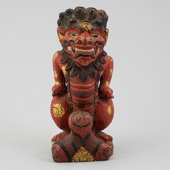 A wooden sculpture of a deity, India, circa 1900.