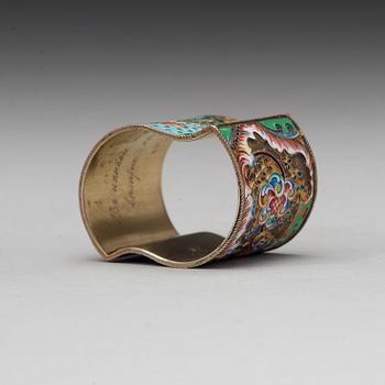 A Russian 20th century silver-gilt and enamelnapkin-ring, marks of the 11th Artel, Moscow 1908-1917.