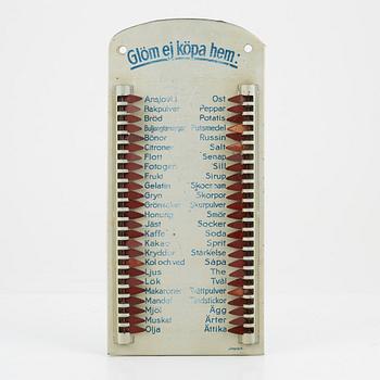 A metal shopping list, 1930's/40's.