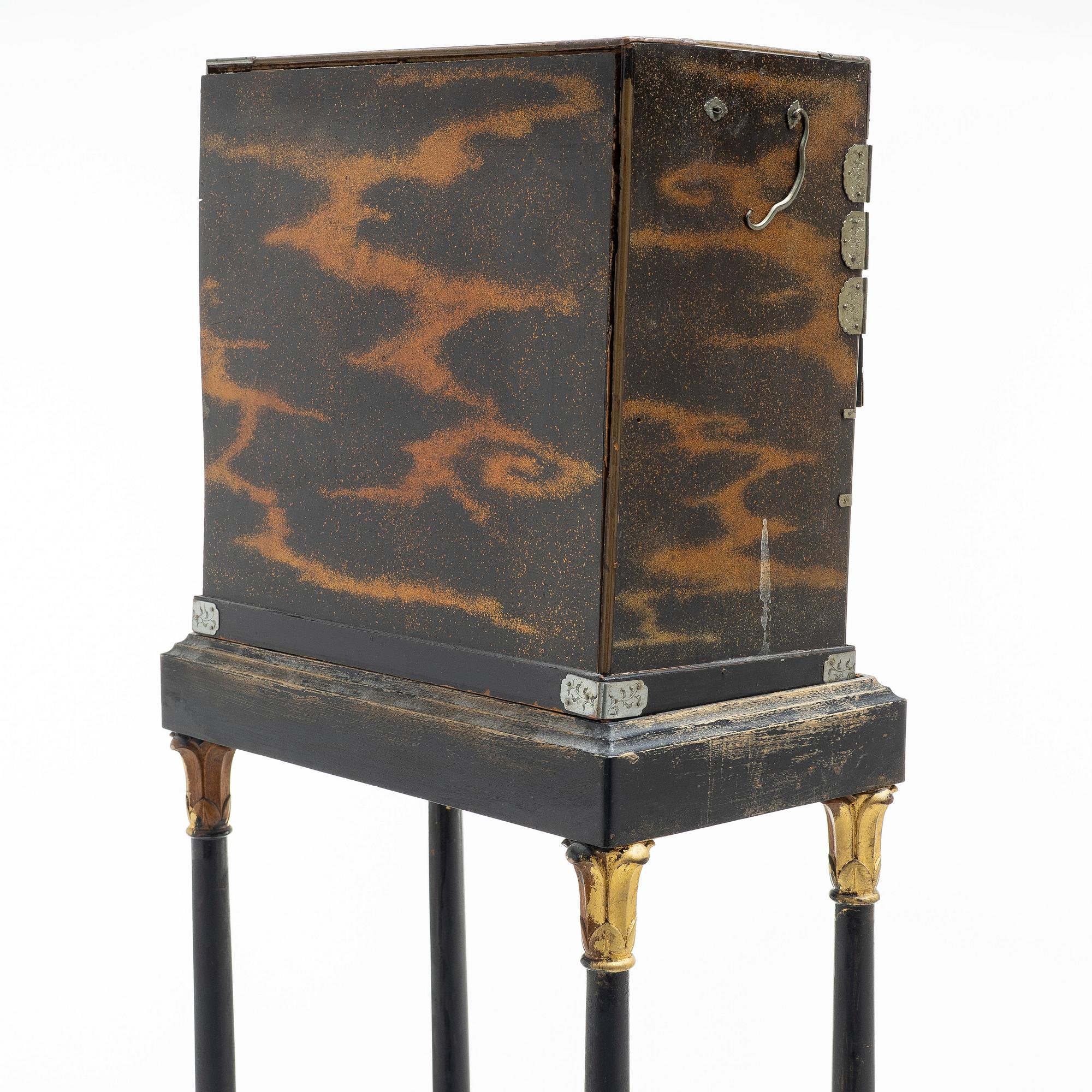 A maki-e cabinet on stand, Japan, 19th century.