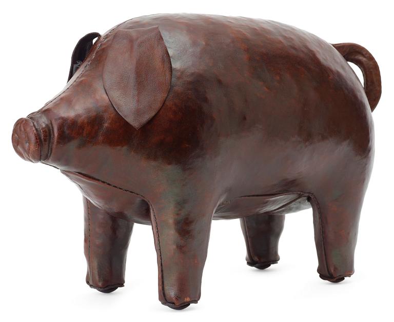 A brown leather figure of a pig by Svenskt Tenn.