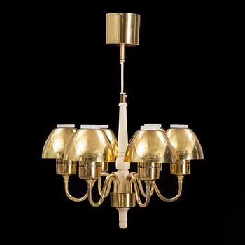 Hans-Agne Jakobsson, a 'T526' brass and wood ceiling light from Markaryd.