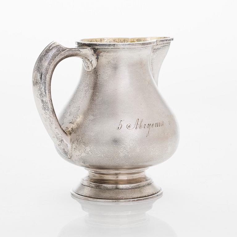 A four-piece silver coffee set, St. Petersburg 1887, original fitted box from Khlebnikov. Sugar tong, Moscow around 190.