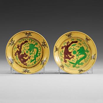 1632. Two yellow ground dragon dishes, China, Republic 20th Century, with Guangxu six character mark.