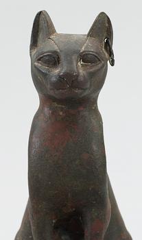 A bronze cat statuette, Egypt, possibly 22-30 Dynasty, 945-332 BC.