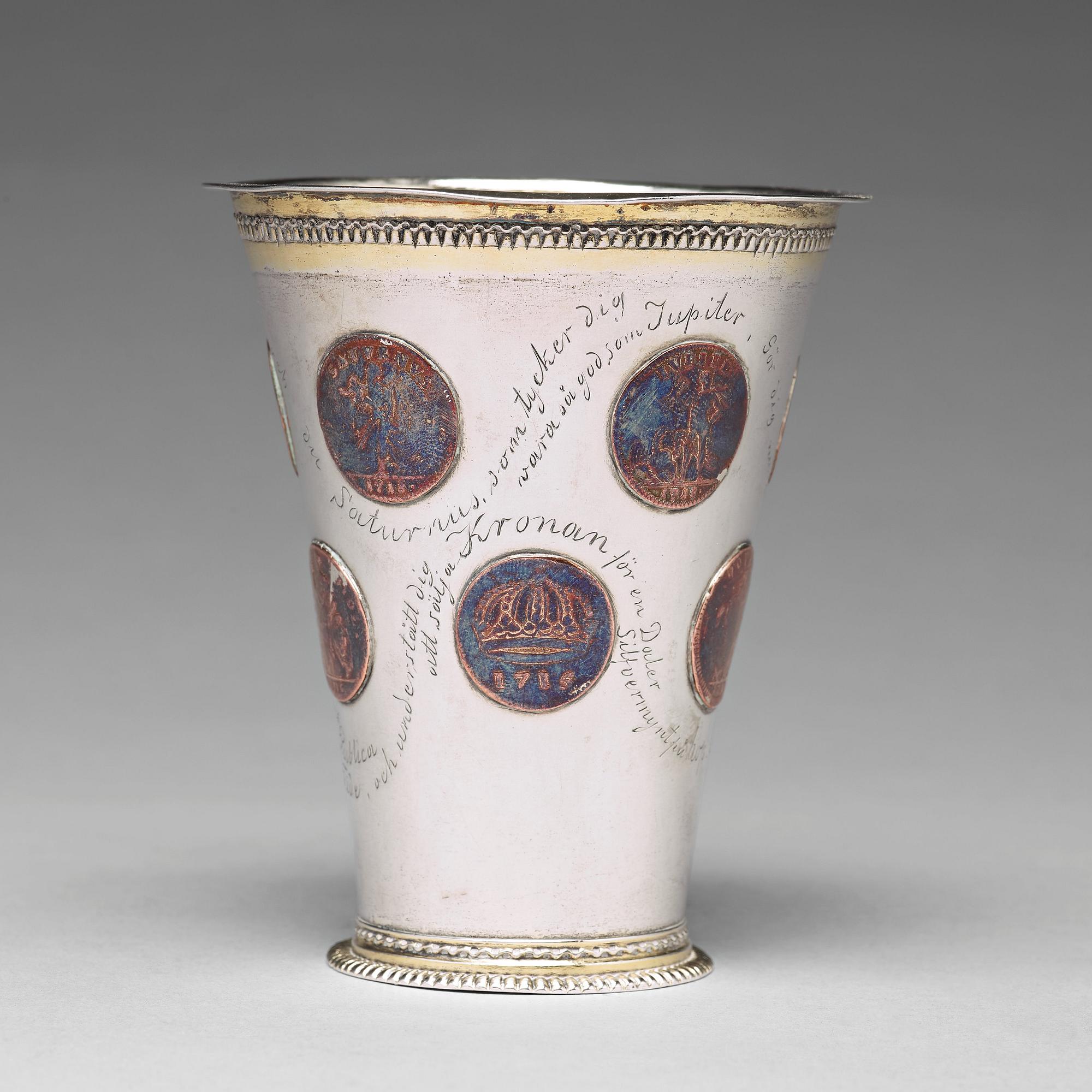 A Swedish 18th century parcel-gilt silver beaker with copper coins, mark of CM Ekman, Eksjö (1729-1738).