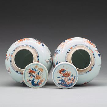 A pair of imari jars with covers, Qing dynasty, 18th Century.