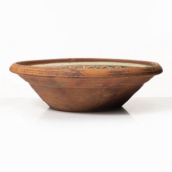 One eathenware bowl and two plates.