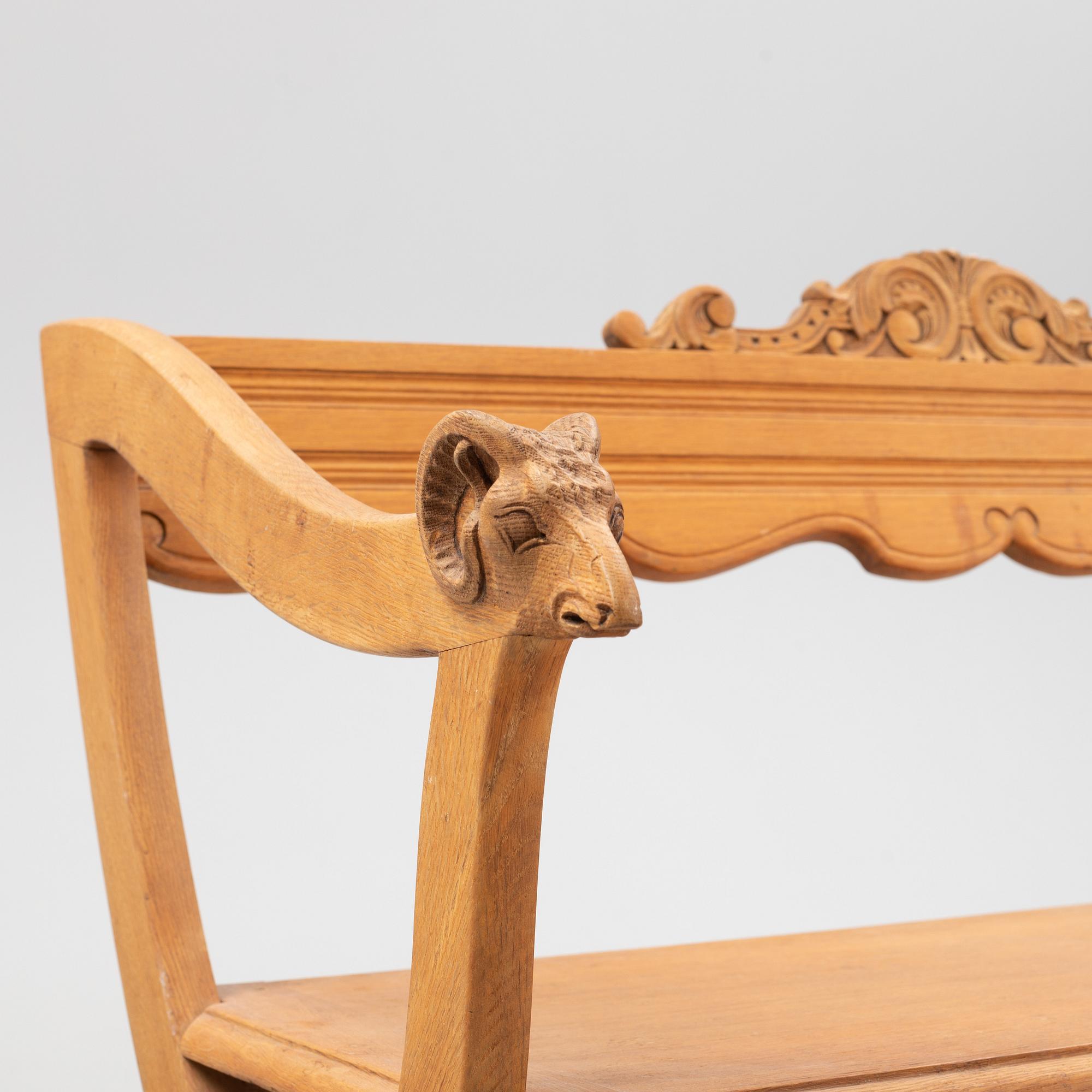 A carved oak sofa, circa 1900.