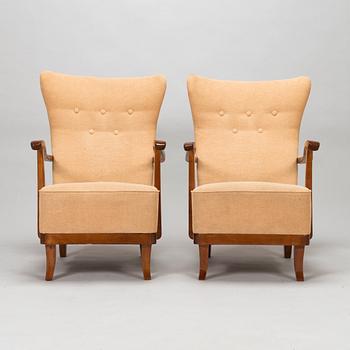 A pair of 1950s armchairs.