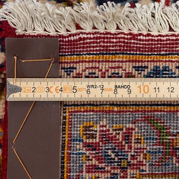 A Keshan carpet, central Iran, signed c, 392 x 301 cm.