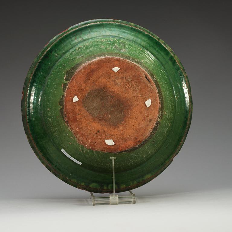 A large green and yellow glazed dish, 18th Century.