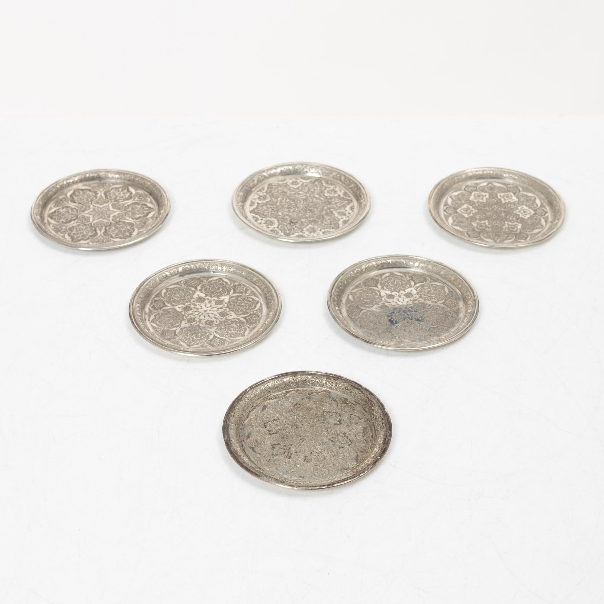 A Persian silver tray, 12 small spoons and six coasters, first part of the 1900s.