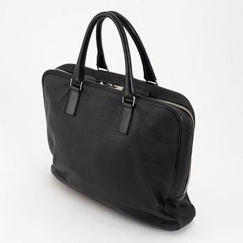 Christian Dior, a black leather briefcase.
