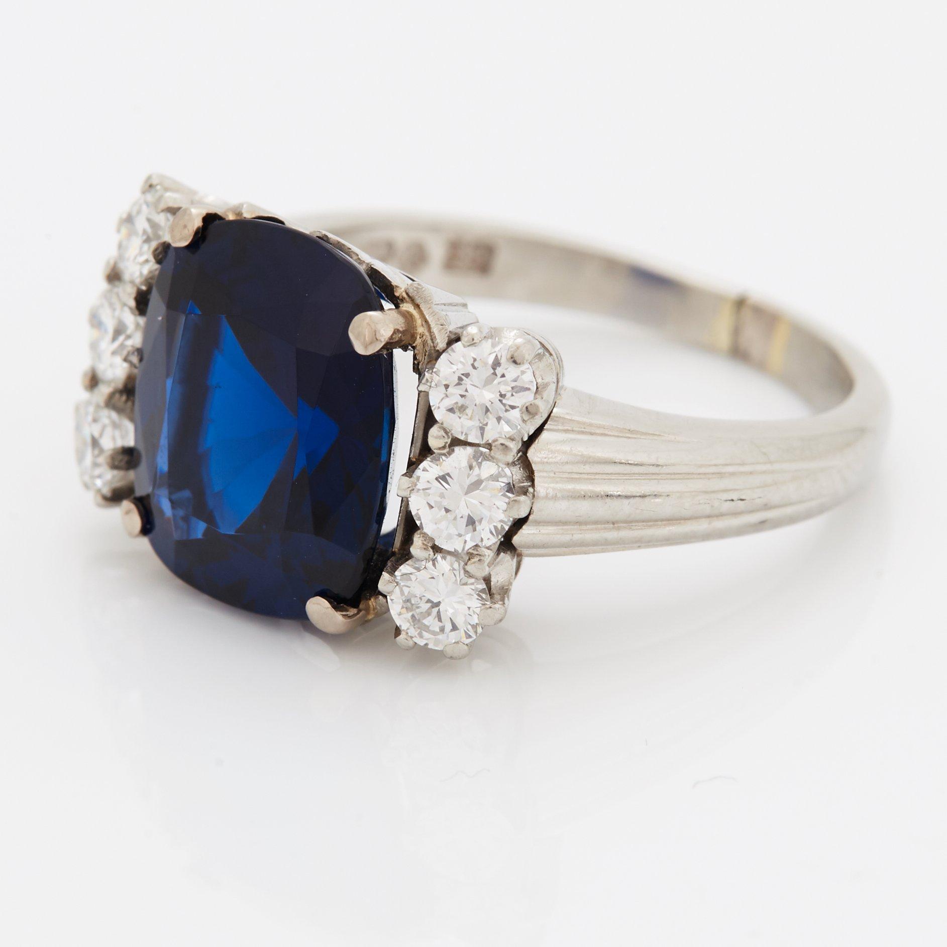 A RING set with a faceted sapphire.