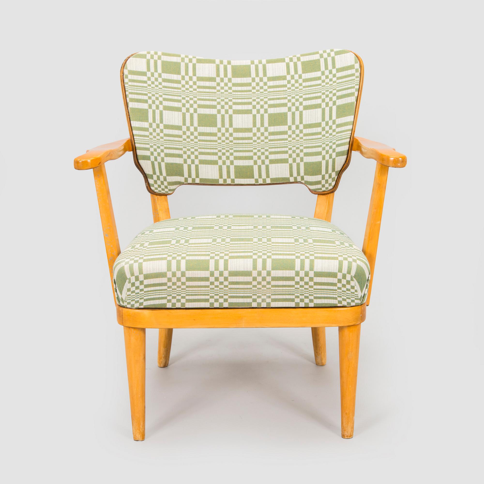 A mid-20th century armchair upholstered with fabric by Johanna Gullichsen.