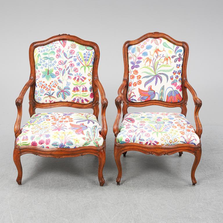 Two 18th century French Louis XV walnut armchairs.