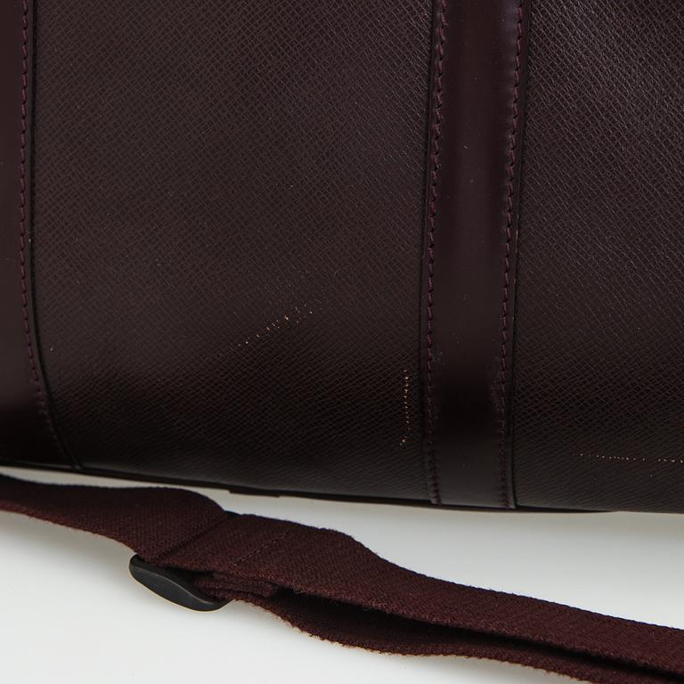 Louis Vuitton, a 'Taiga Kendall PM' weekend bag.