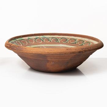 One eathenware bowl and two plates.
