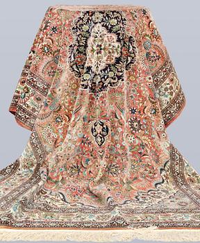 An Oriental silk rug, approx. 240 x 153 cm.