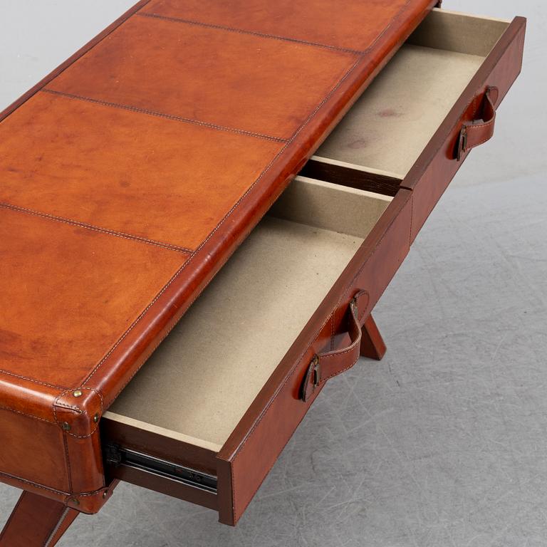 A contemporary dressing table with stool.