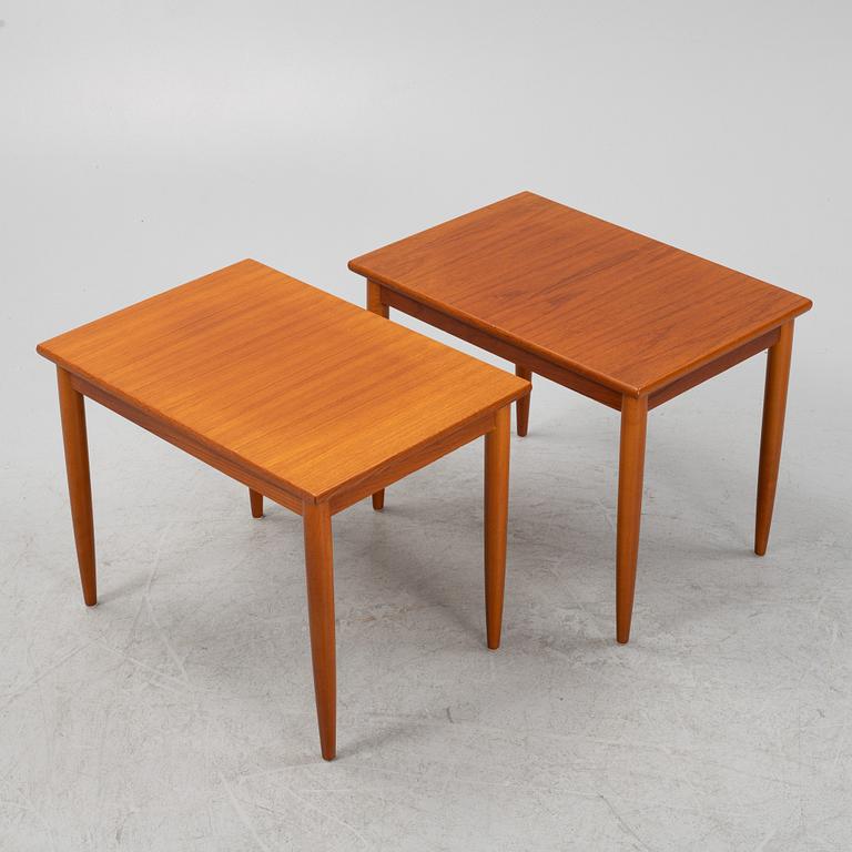 A pair of teak veneered side tables, second part of the 20th Century.