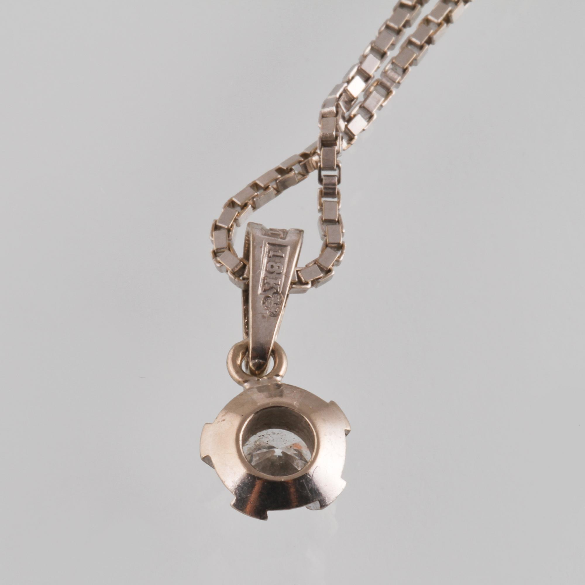 HÄNGE, 18K vitguld med briljantslipad diamant ca 0.23 ct, Bims guldsmide Göteborg. Vikt 4,8 gram.