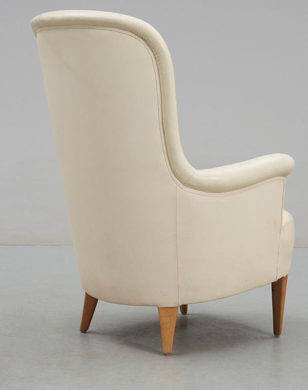 A Carl Malmsten 'Marino' white leather easy chair.