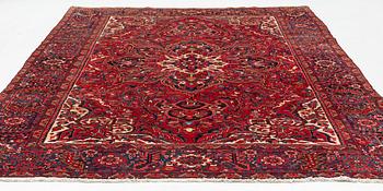 A semi-antique/old Heriz carpet, c 348 x 264 cm.