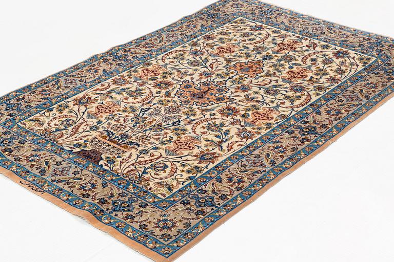 A rug, semi-antique, Esfahan, signed Ghena, ca 166 x 109 cm.