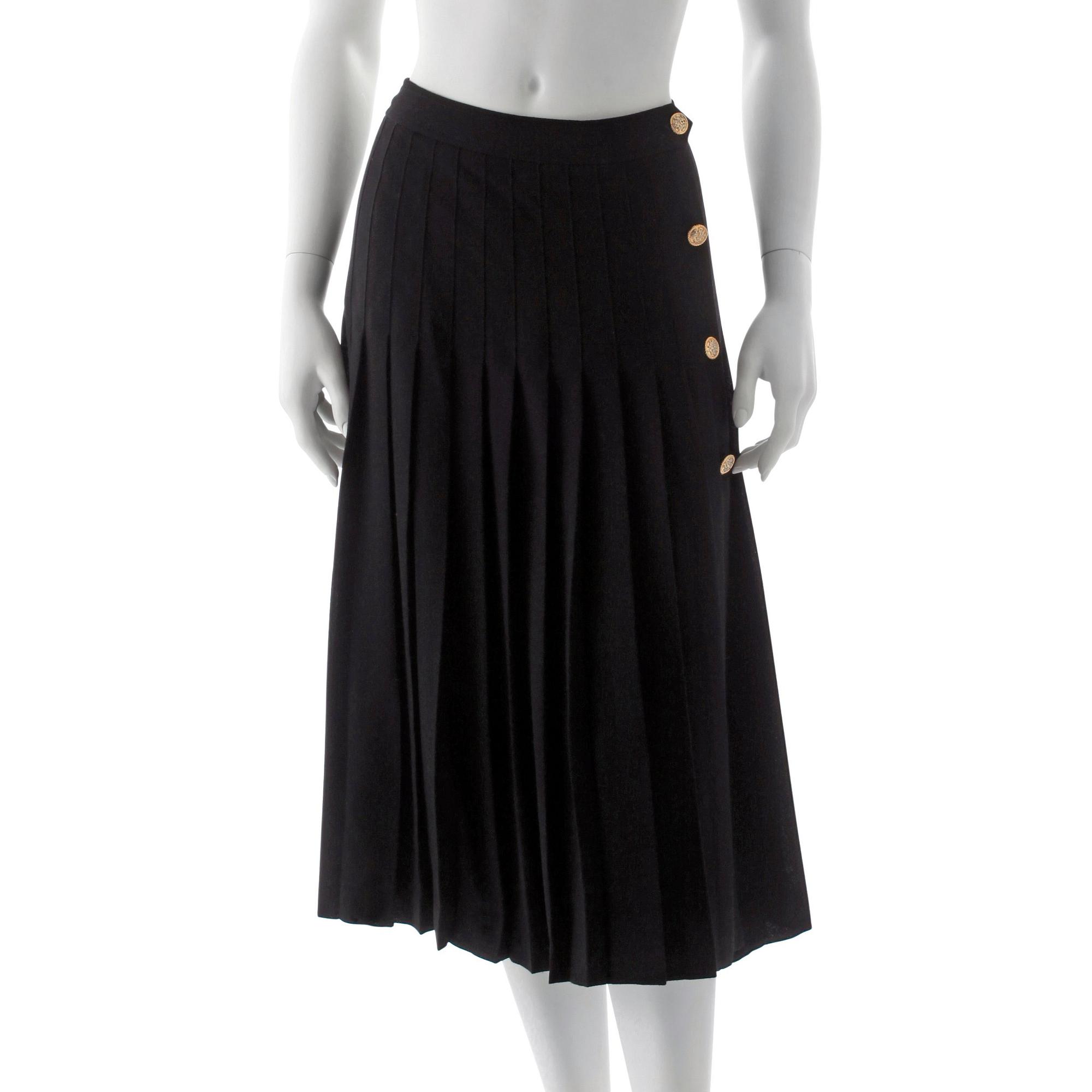 CÉLINE, a black pleated wool skirt.