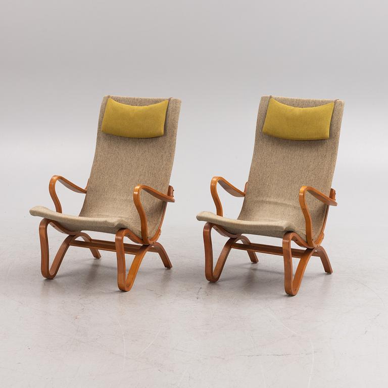 A pair of birch tree easy chairs. Mid 20th century.