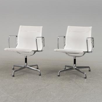 A pair of 'EA 108' desk chairs by Charles & Ray Eames for Vitra.