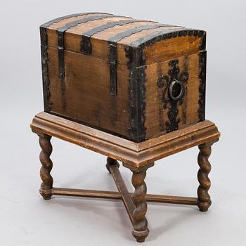 A oak baroque chest on a later leg frame.