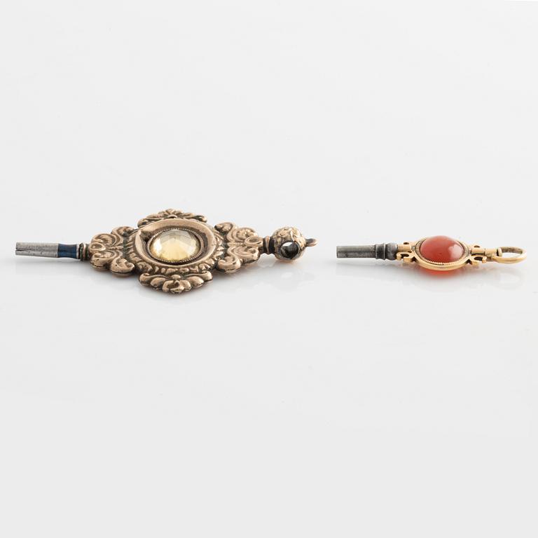 Two pocket watch key winders, gold, citrine and carnelian, 19th century.