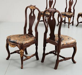 A set of 12 rococostyle chairs, 20 th century.