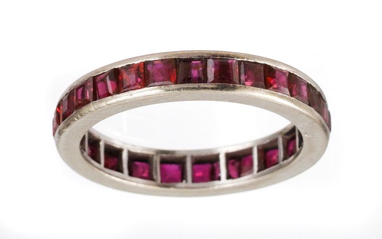 ETERNITYRING, set with carré cut rubies.