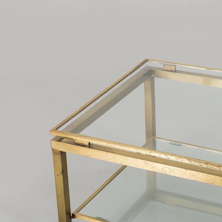 A BRASS GLASS TOP COFFEE TABLE.