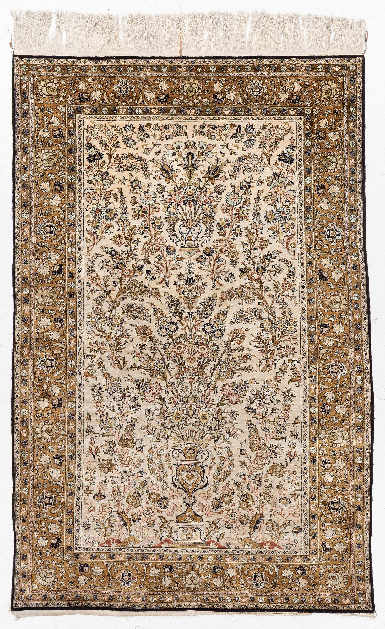 A Ghom, silk rug, c. 215 x 140 cm.