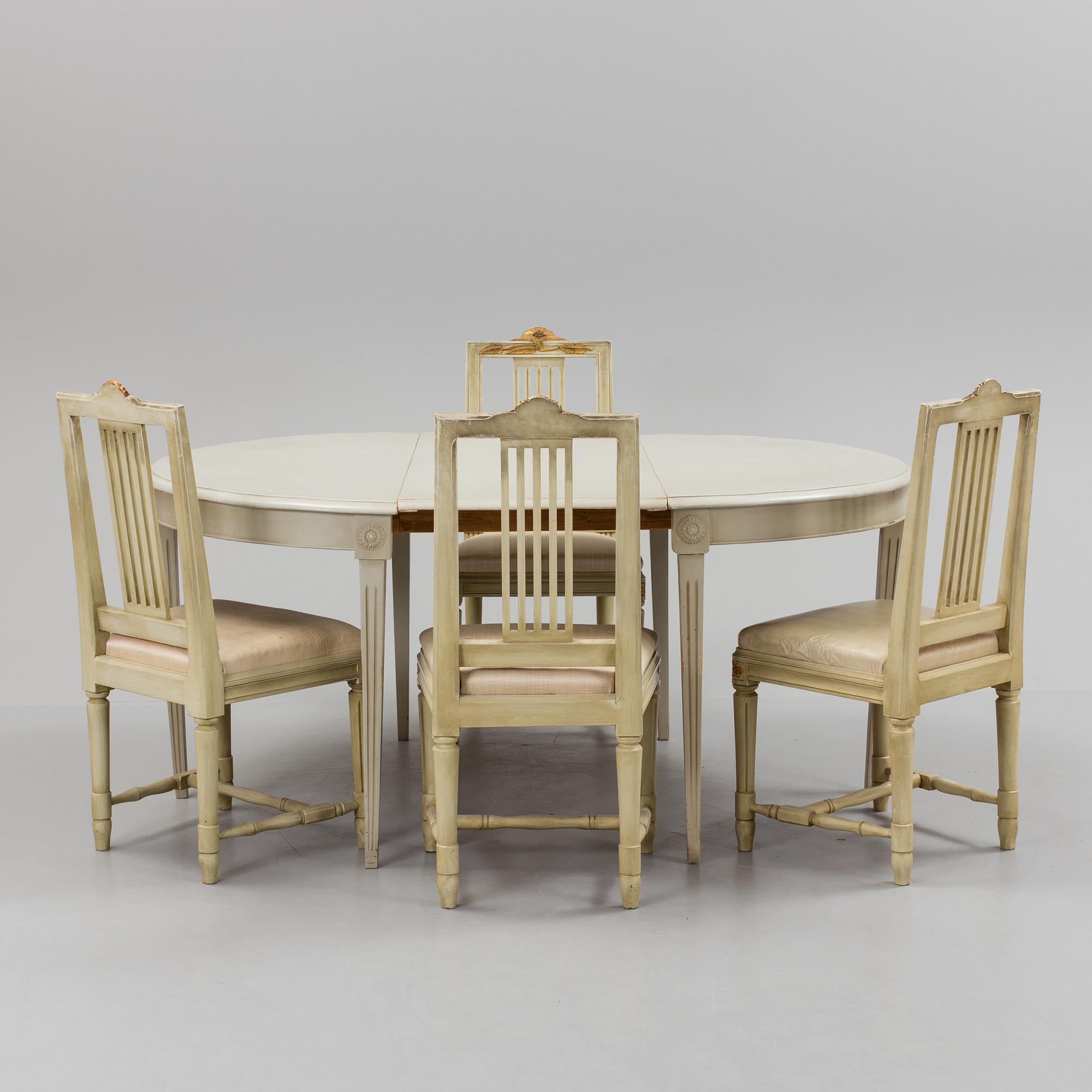 A lot of four mid 20th century Swedish Gustavian style chairs and one dinner table from around year 1900.