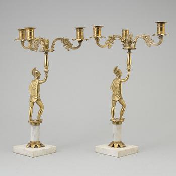 A pair of brass and marble candelabra, early 20th century with older parts.