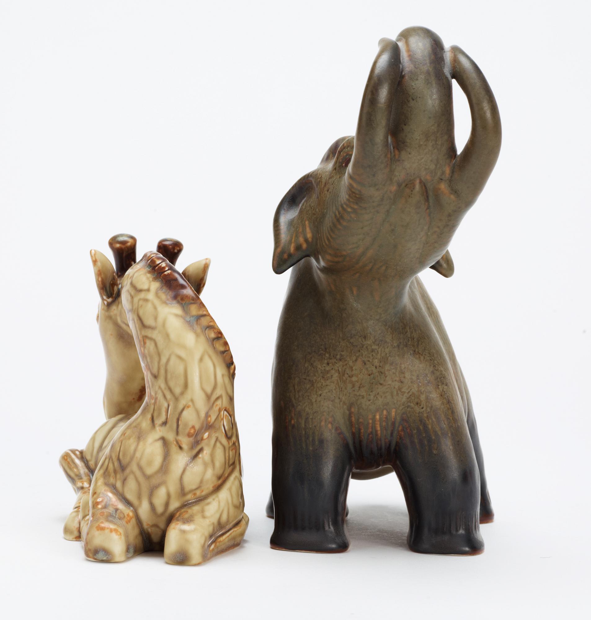 Two Gunnar Nylund stoneware figures, a giraffe and a mammoth, Rörstrand.